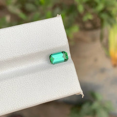 Discover the natural beauty of this 1.00-carat bluish green Tourmaline from Afghanistan, featuring a classic Emerald cut that highlights its attractive color and elegant shape.