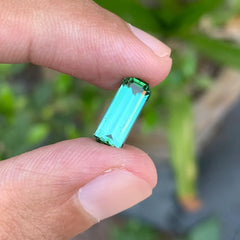 Discover the elegant beauty of this 2.50-carat natural bluish green tourmaline from Afghanistan, expertly cut in a classic emerald cut.