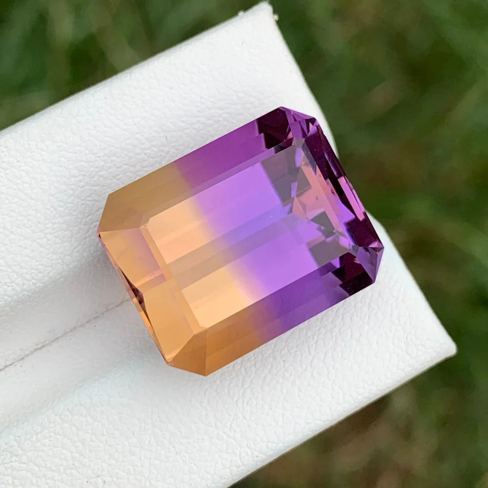 Shop a 26.25 Ct Ametrine from Bolivia featuring an Emerald cut and natural amethyst