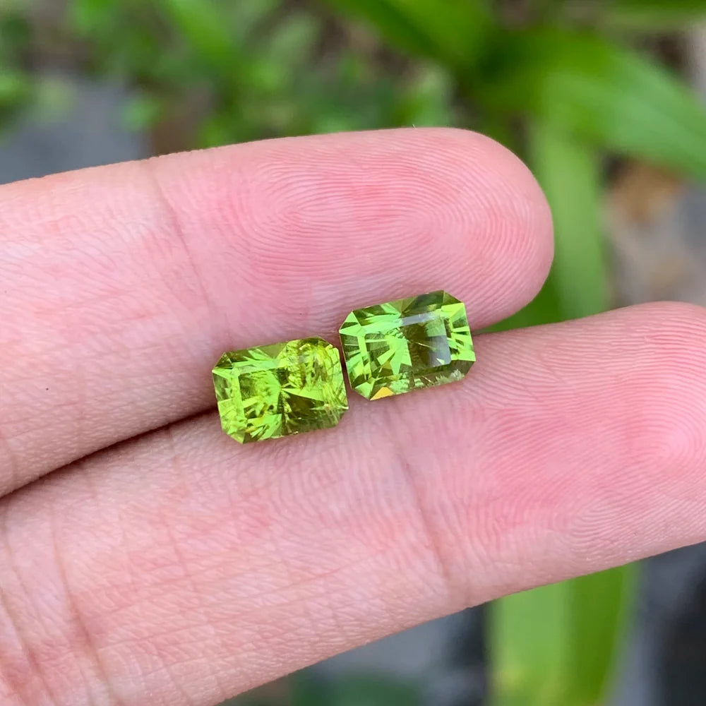 Shop a 3.55 Ct natural bright green peridot pair from Pakistan with elegant emerald cuts. Untreated loose August birthstones for custom jewelry.