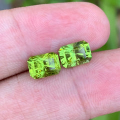 Discover the vibrant beauty of this 3.55-carat natural peridot pair from Pakistan, featuring a beautiful bright green color and elegant emerald cuts. 