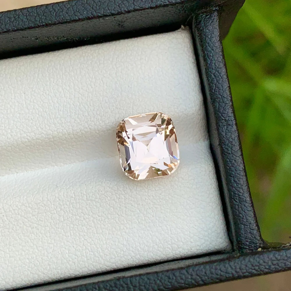 Discover the elegant beauty of this 3.80-carat light golden Morganite gemstone from Afghanistan, expertly cut in a classic cushion cut.