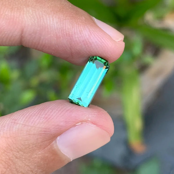 Discover the elegant beauty of this 2.50-carat natural bluish green tourmaline from Afghanistan, expertly cut in a classic emerald cut.