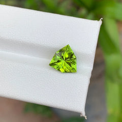 Shop this 3.10 ct bright green peridot from Pakistan, featuring a trillion cut. 