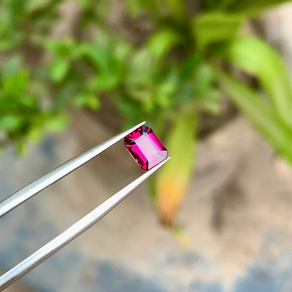 Shop a 1.15 Ct Hot Pink Rhodolite Garnet from Africa with an Emerald cut. Natural, untreated loose Garnet ideal for custom jewelry and collectors.
