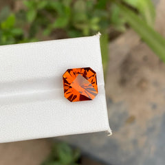 Discover the vibrant beauty of this 5.70-carat Madeira citrine from Uruguay, featuring a striking bright orange color and an elegant fancy square cut. 