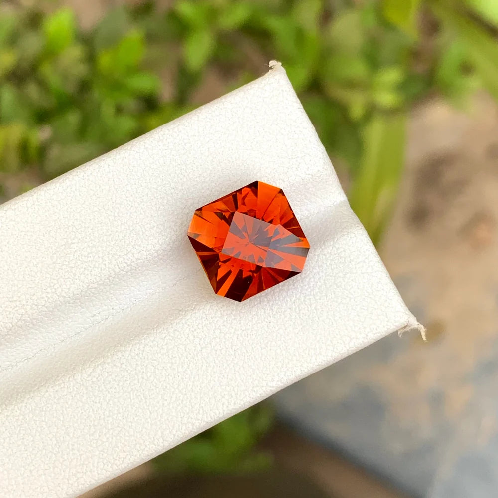 Discover the vivid beauty of this 6.75-carat Madeira citrine from Uruguay, featuring a striking bright orange color and an elegant square cut.
