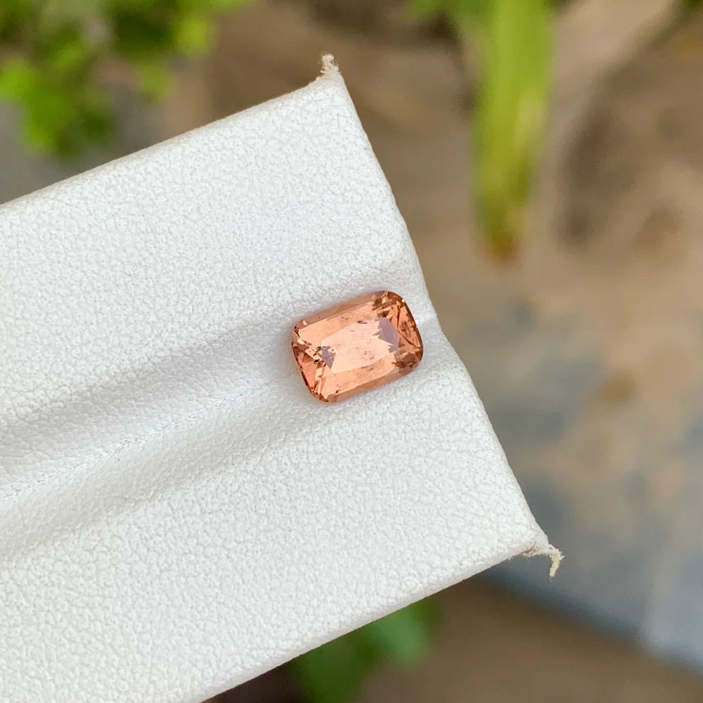 Shop this 1.95 Ct natural peach spinel from Africa with an elegant cushion cut