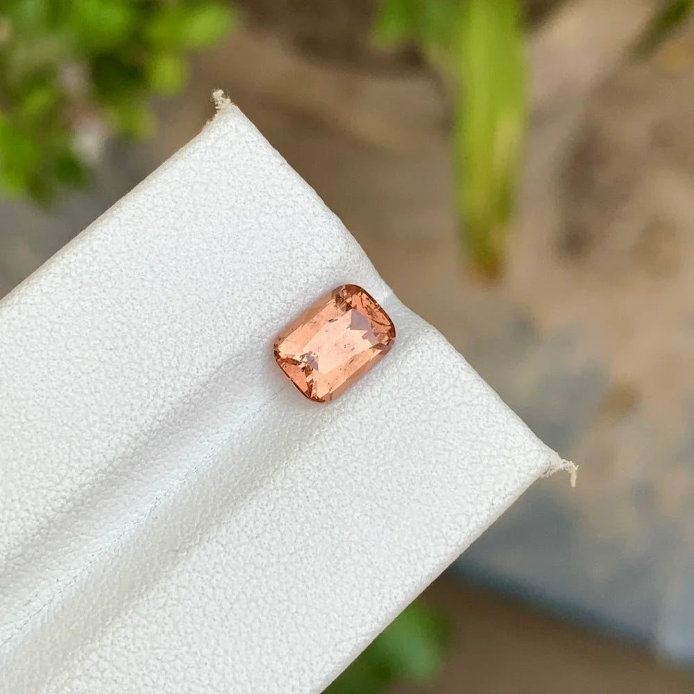 Discover the delicate beauty of this 1.95-carat natural peach spinel from Africa, featuring a soft and attractive peach color with an elegant cushion cut.